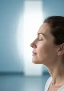 A person with eyes closed in a calm meditation pose, illustrating mental wellness, stress relief, and improved sleep focus
